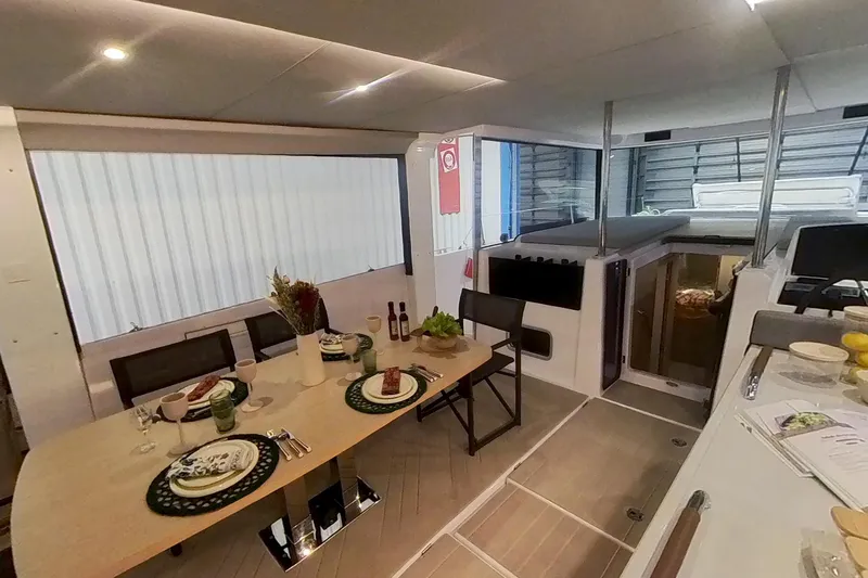 Slide: The Image of Interior of 2026 Jeanneau Sea Loft 480 yacht, featuring elegant dining setup. - 10