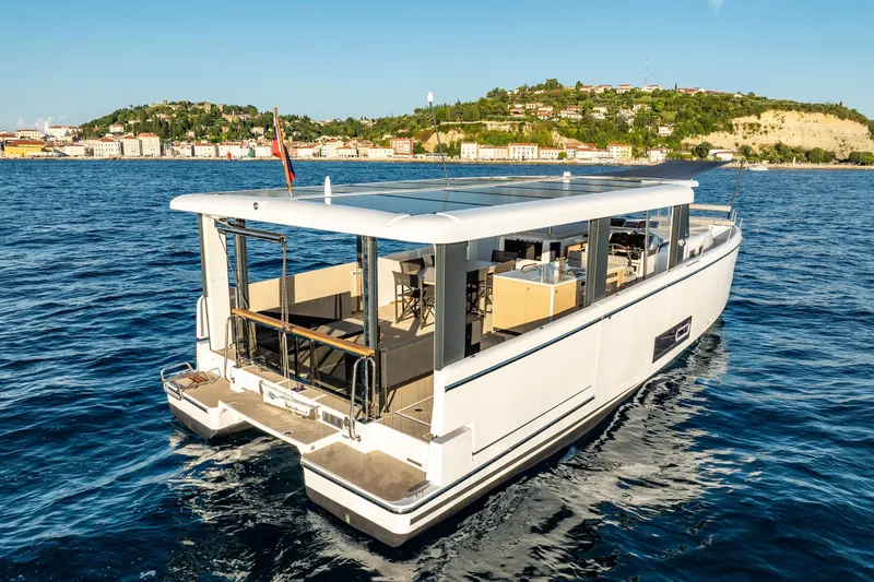 Slide: The Image of 2026 Jeanneau Sea Loft 480 yacht cruising near scenic coastline. - 3