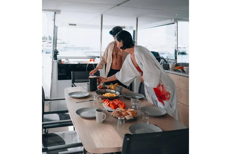 Slide: The Image of Manufacturer Provided Image: Couple enjoying breakfast on Jeanneau Sea Loft 480 yacht, 2026 model. - 7