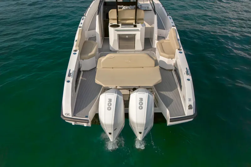 Slide: The Image of 2023 Rio Yachts Daytona 34 with dual engines on clear water. - 11