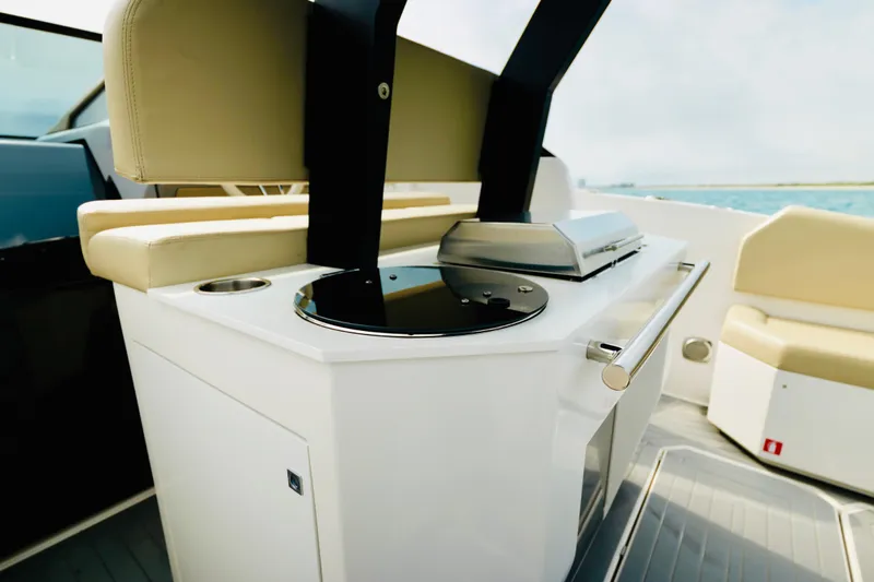 Slide: The Image of 2023 Rio Yachts Daytona 34 interior with modern seating and sleek kitchen area. - 16