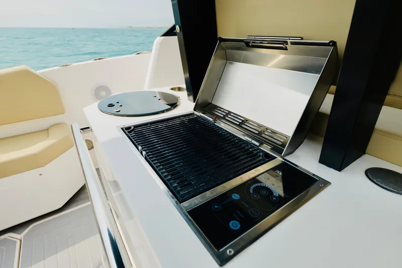 Slide: The Image of Outdoor grill on 2023 Rio Yachts Daytona 34, with ocean view and seating area. - 17