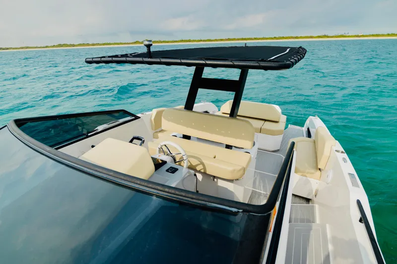 Slide: The Image of 2023 Rio Yachts Daytona 34 on turquoise water, featuring sleek design and comfortable seating. - 19