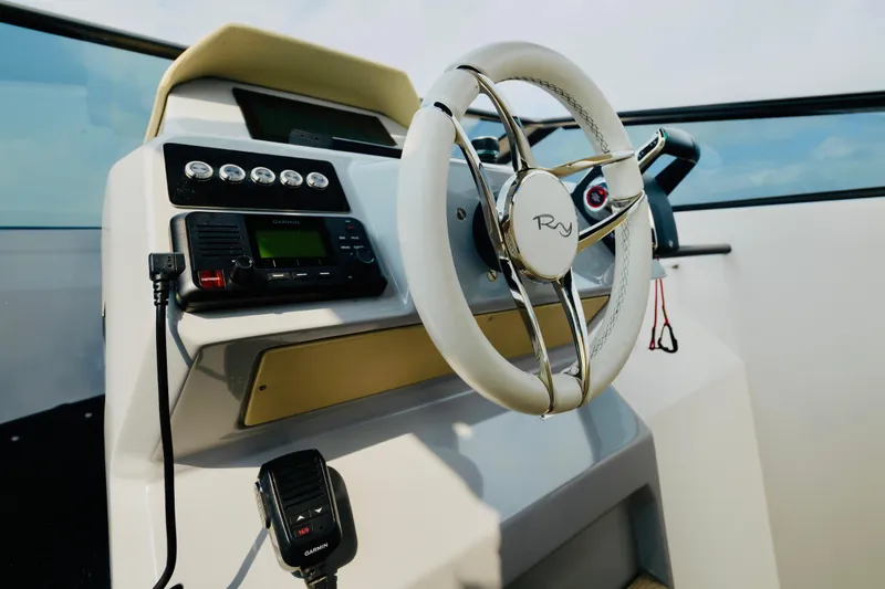 Slide: The Image of 2023 Rio Yachts Daytona 34 helm with modern steering and controls. - 21
