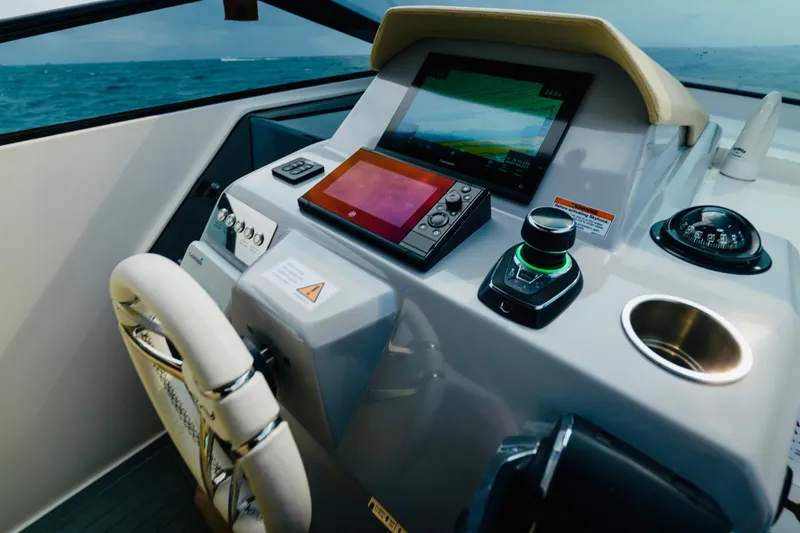 Slide: The Image of 2023 Rio Yachts Daytona 34 helm with advanced navigation and control systems. - 22
