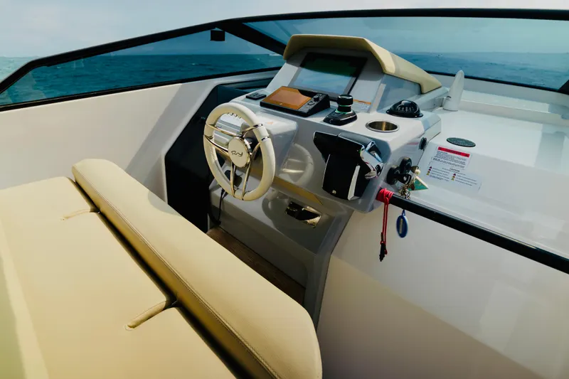 Slide: The Image of 2023 Rio Yachts Daytona 34 cockpit with modern steering and navigation controls. - 25