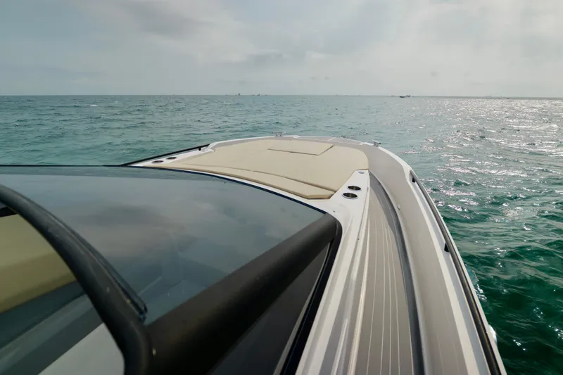 Slide: The Image of 2023 Rio Yachts Daytona 34 cruising on open sea under cloudy sky. - 27