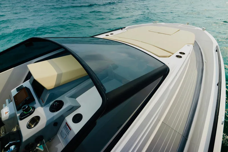 Slide: The Image of 2023 Rio Yachts Daytona 34, sleek design, cruising on clear blue water. - 28