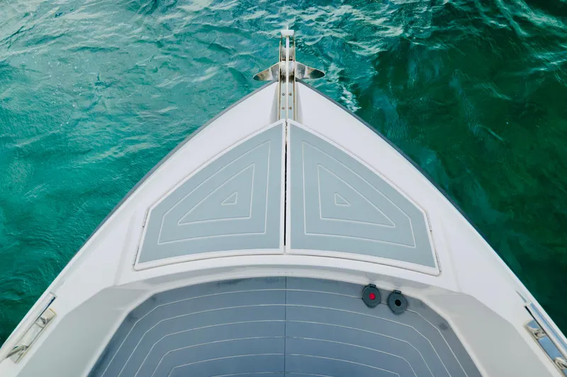 Slide: The Image of 2023 Rio Yachts Daytona 34 bow on turquoise water. - 30