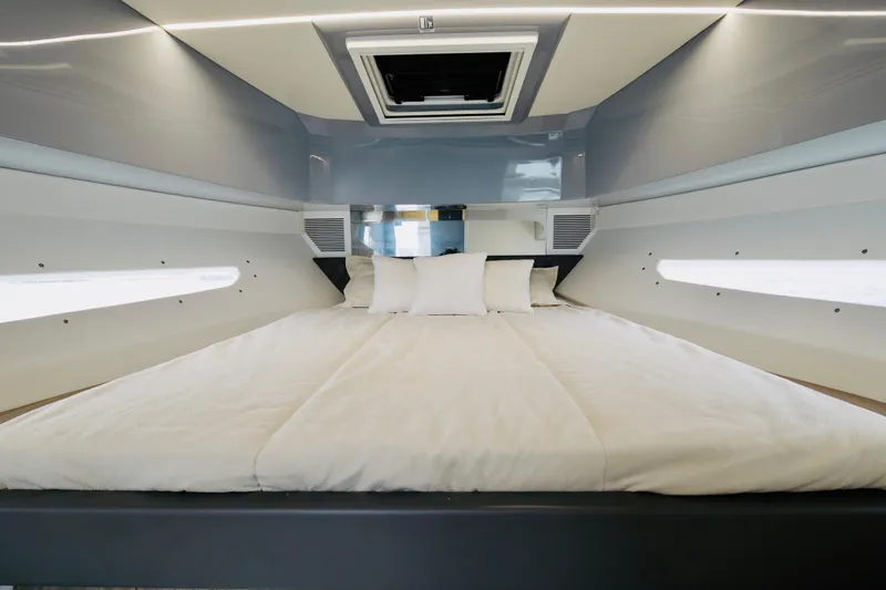 Slide: The Image of Luxurious cabin interior of 2023 Rio Yachts Daytona 34 with modern bedding. - 34