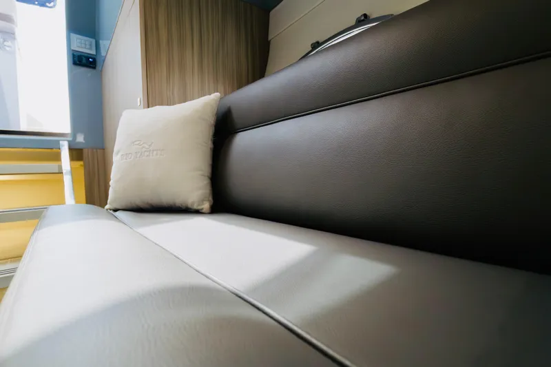Slide: The Image of Luxurious interior of 2023 Rio Yachts Daytona 34 with plush seating and branded cushion. - 40