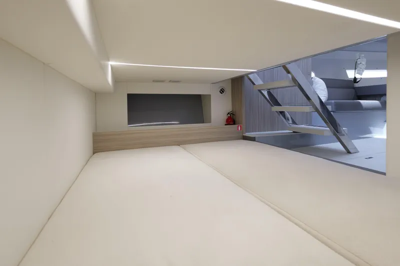 Slide: The Image of 2023 Rio Yachts Daytona 34 interior cabin with modern design and sleek staircase. - 44