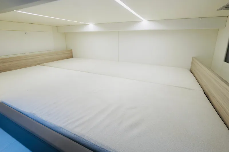 Slide: The Image of Interior cabin of 2023 Rio Yachts Daytona 34, featuring a spacious bed and modern design. - 45