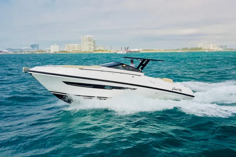 Slide: The Image of 2023 Rio Yachts Daytona 34 cruising on ocean near city skyline. - 5