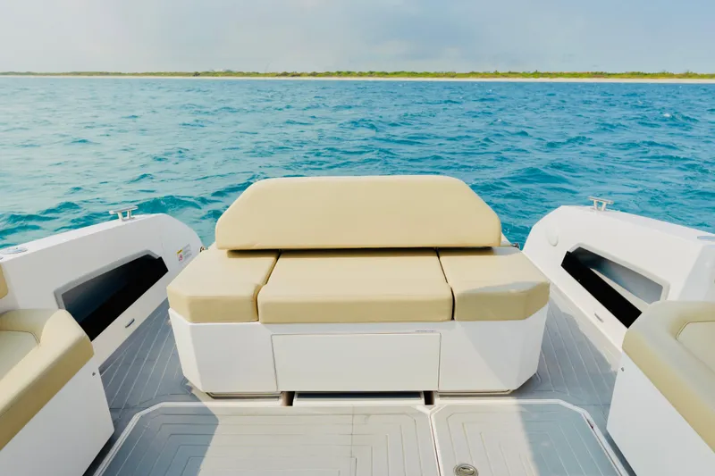 Slide: The Image of 2023 Rio Yachts Daytona 34, rear seating view, on open water. - 9