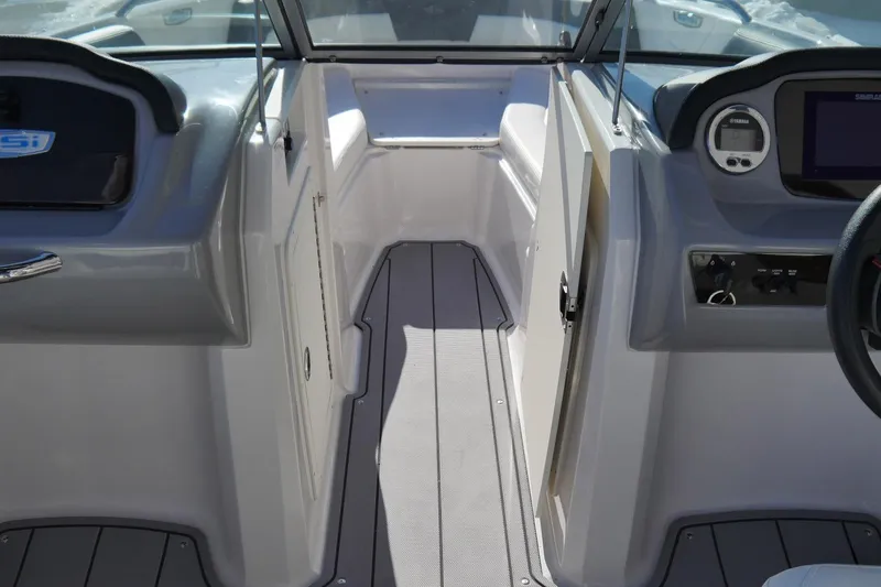Slide: The Image of 2023 Chaparral 21 SSi Ski & Fish OB boat interior with modern dashboard and seating. - 11