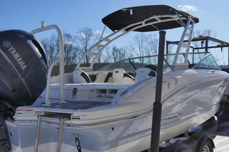 Slide: The Image of 2023 Chaparral 21 SSi Ski & Fish OB boat with Yamaha outboard motor, docked outdoors. - 3