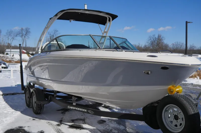 Slide: The Image of 2023 Chaparral 21 SSi Ski & Fish OB boat on trailer in snowy setting. - 4