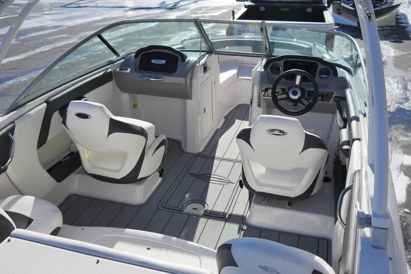Slide: The Image of 2023 Chaparral 21 SSi Ski & Fish OB boat interior with modern seating and dashboard. - 6