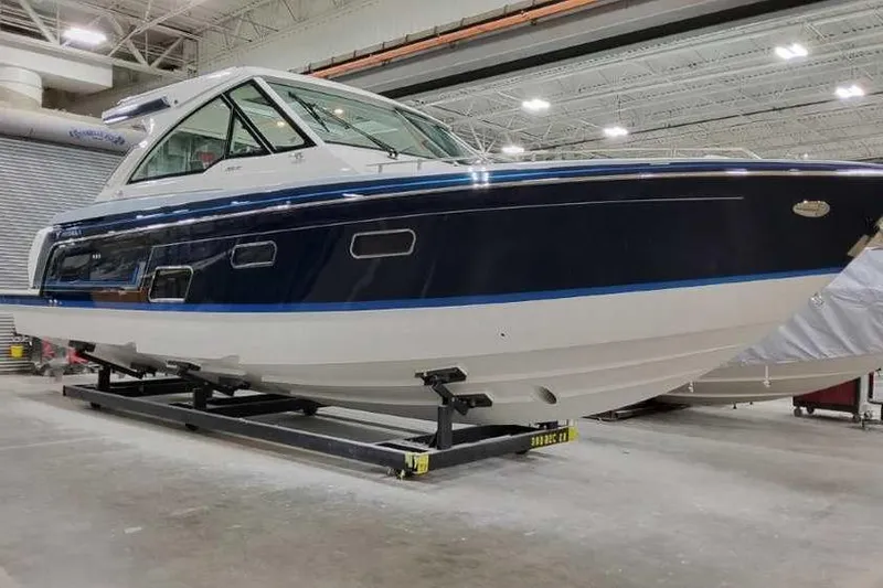 The Image of 2023 Formula 380 Super Sport Crossover OB boat in a showroom, side view. - 0