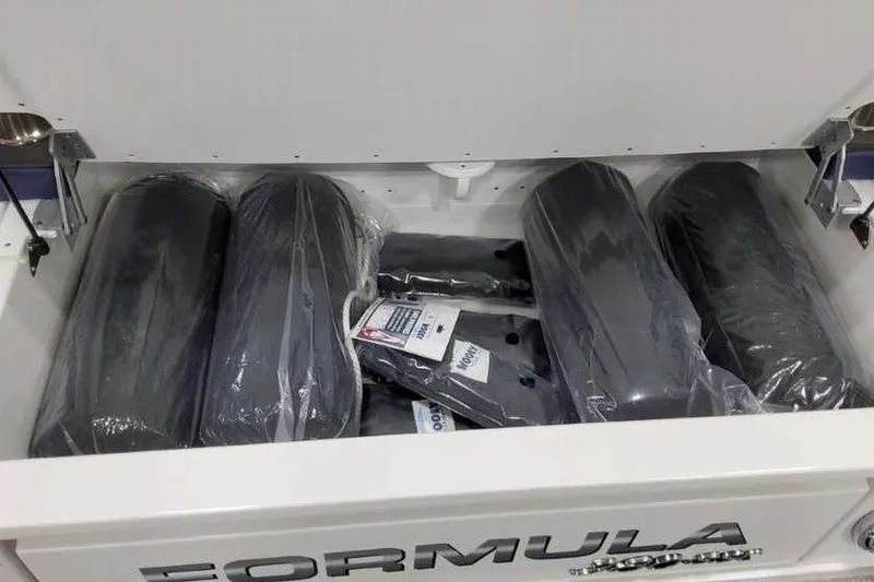 Slide: The Image of Storage compartment of 2023 Formula 380 Super Sport Crossover OB with packaged accessories. - 13