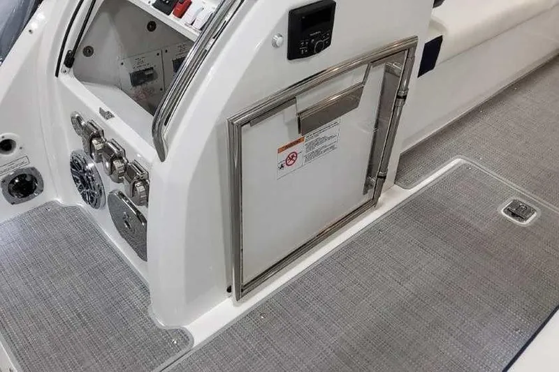 Slide: The Image of 2023 Formula 380 Super Sport Crossover OB interior with control panel and storage compartment. - 15