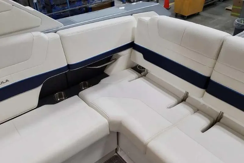 Slide: The Image of 2023 Formula 380 Super Sport Crossover OB interior seating with white and blue upholstery. - 19