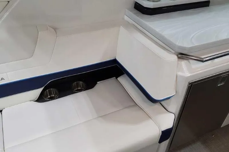 Slide: The Image of 2023 Formula 380 Super Sport Crossover OB interior with white seating and cup holders. - 29