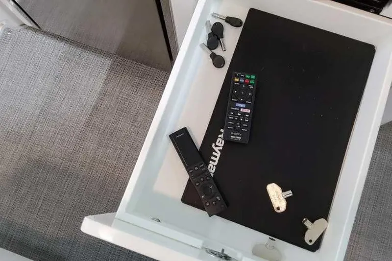 Slide: The Image of Drawer with remotes, keys, and accessories on a Formula 380 Super Sport Crossover OB, 2023. - 32