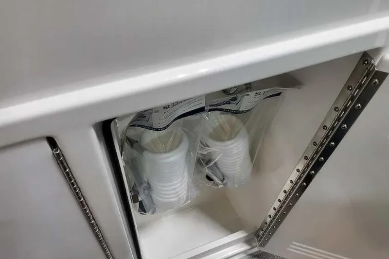 Slide: The Image of Storage compartment with packaged cups in 2023 Formula 380 Super Sport Crossover OB. - 36