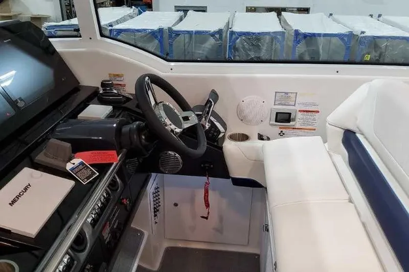 Slide: The Image of 2023 Formula 380 Super Sport Crossover OB cockpit with steering wheel and control panel. - 38