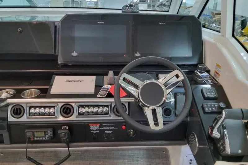 Slide: The Image of 2023 Formula 380 Super Sport Crossover OB dashboard with dual screens and modern controls. - 41