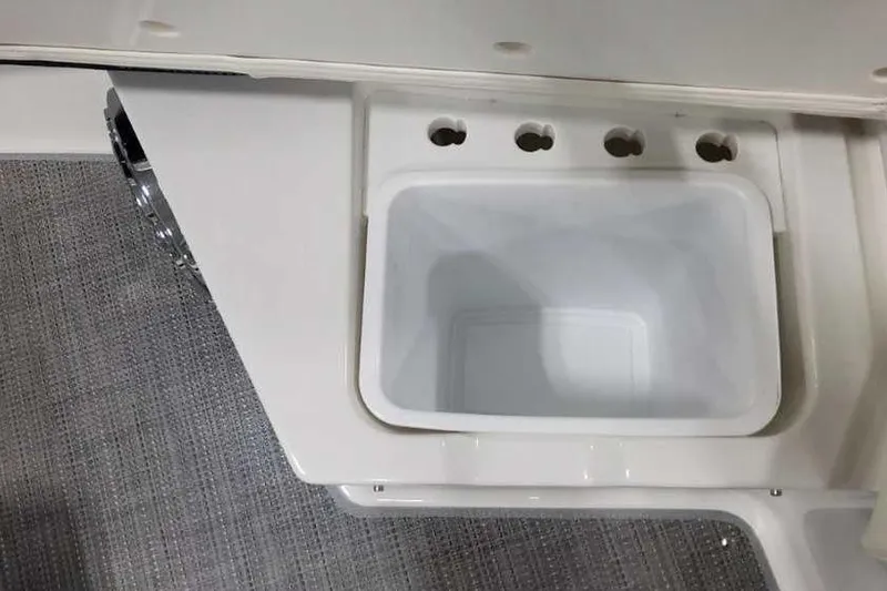 Slide: The Image of 2023 Formula 380 Super Sport Crossover OB boat storage compartment with integrated cup holders. - 46
