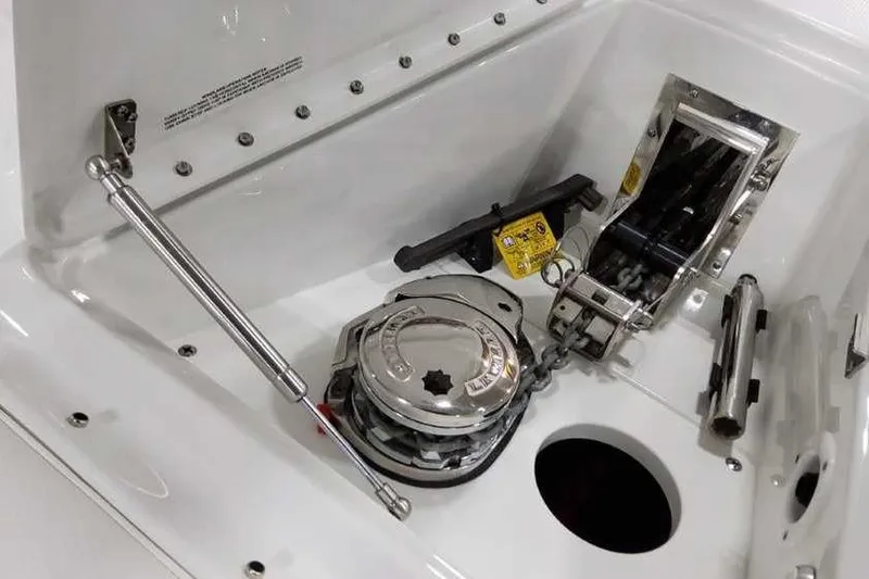 Slide: The Image of 2023 Formula 380 Super Sport Crossover OB anchor compartment with winch and chain mechanism. - 52