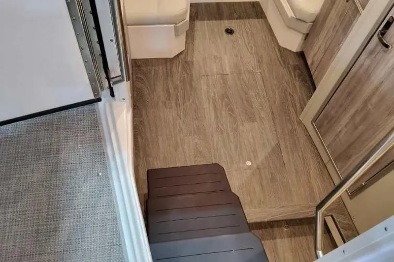 Slide: The Image of 2023 Formula 380 Super Sport Crossover OB interior with wood flooring and seating. - 54