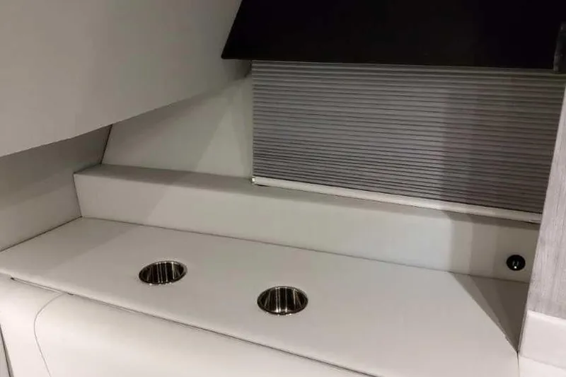 Slide: The Image of Interior of 2023 Formula 380 Super Sport Crossover OB with cup holders and sleek design. - 59