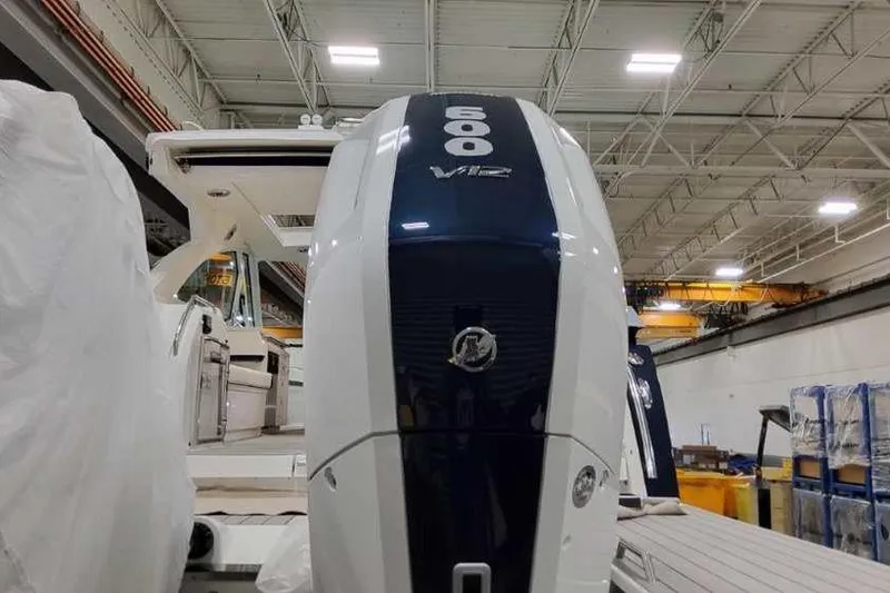 Slide: The Image of 2023 Formula 380 Super Sport Crossover OB with powerful 600 V12 engine in a warehouse. - 6