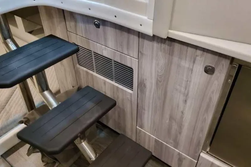 Slide: The Image of Interior stairs of 2023 Formula 380 Super Sport Crossover OB, featuring sleek wood paneling. - 68