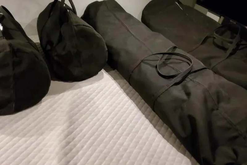 Slide: The Image of Black duffel bags on a quilted surface, related to Formula 380 Super Sport Crossover OB. - 72