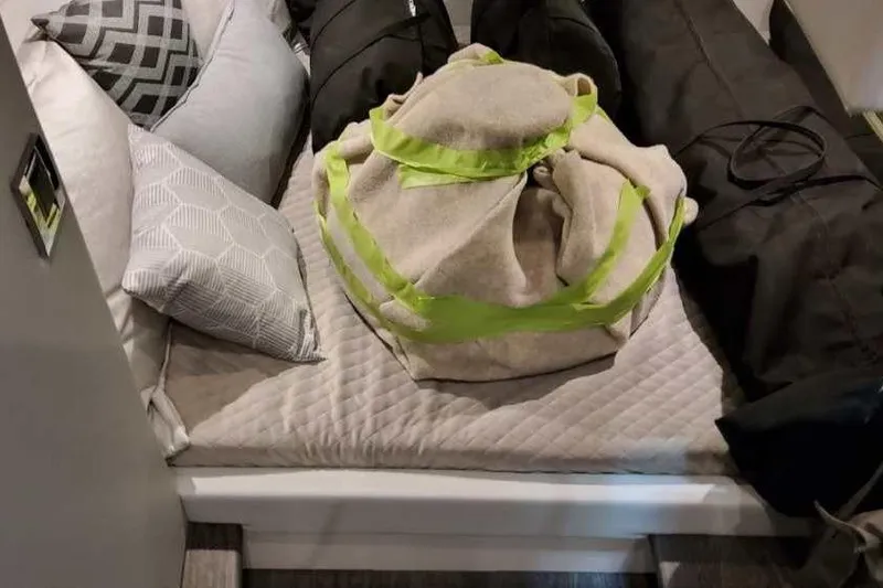 Slide: The Image of Cozy cabin interior of 2023 Formula 380 Super Sport Crossover OB with pillows and bags. - 73