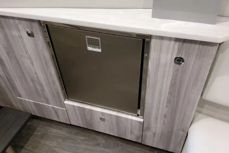 Slide: The Image of 2023 Formula 380 Super Sport Crossover OB interior with built-in stainless steel fridge. - 74