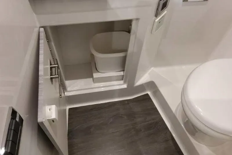 Slide: The Image of 2023 Formula 380 Super Sport Crossover OB bathroom with storage cabinet and modern design. - 76