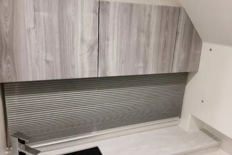 Slide: The Image of 2023 Formula 380 Super Sport Crossover OB interior with modern wood cabinetry. - 77