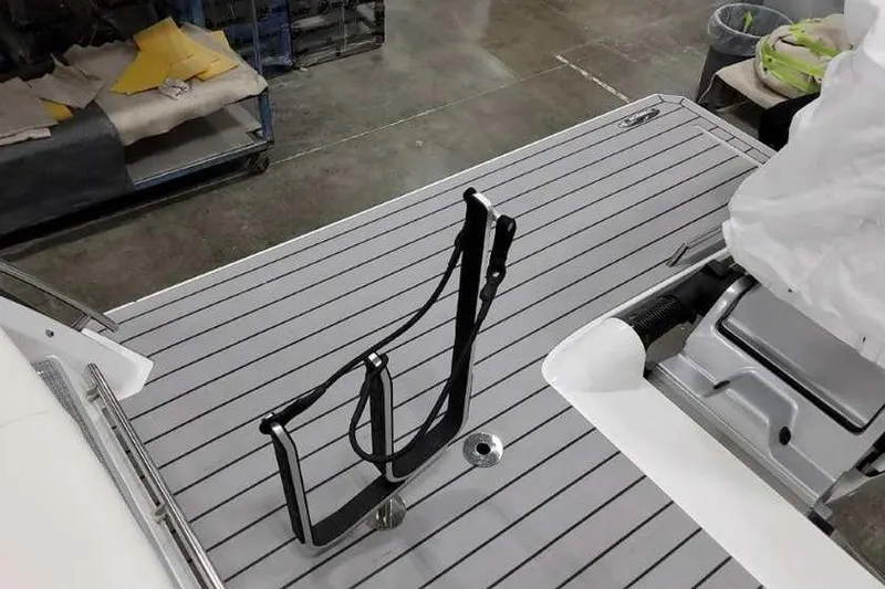 Slide: The Image of 2023 Formula 380 Super Sport Crossover OB boat deck with ladder and storage. - 8