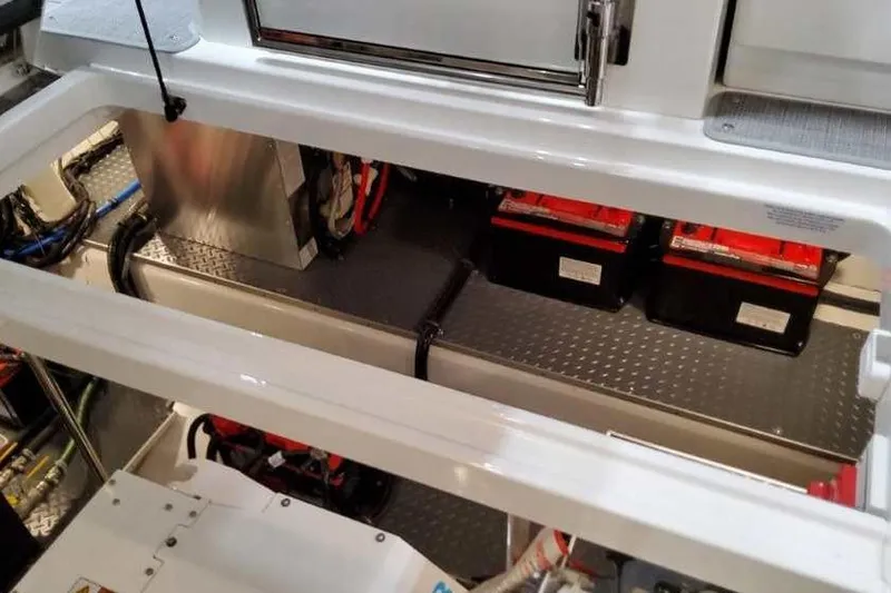 Slide: The Image of 2023 Formula 380 Super Sport Crossover OB engine compartment with batteries and wiring. - 81