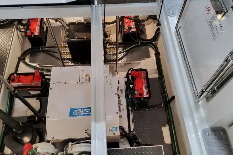 Slide: The Image of Engine compartment of 2023 Formula 380 Super Sport Crossover OB with batteries and wiring. - 82