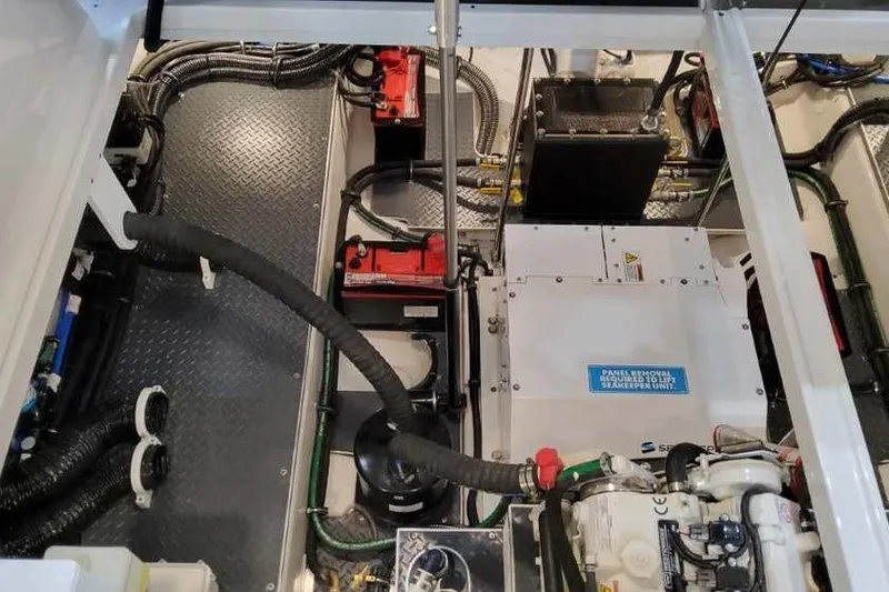 Slide: The Image of Engine compartment of 2023 Formula 380 Super Sport Crossover OB with visible components and wiring. - 83