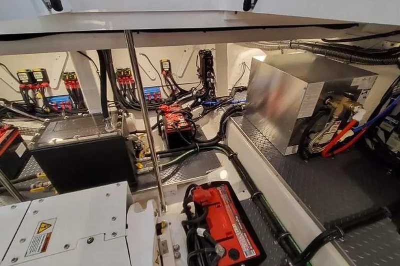 Slide: The Image of Engine room of 2023 Formula 380 Super Sport Crossover OB, showcasing batteries and wiring. - 84