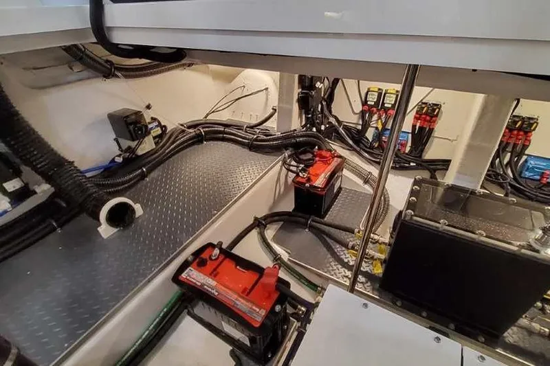 Slide: The Image of Engine room of 2023 Formula 380 Super Sport Crossover OB with batteries and wiring. - 85