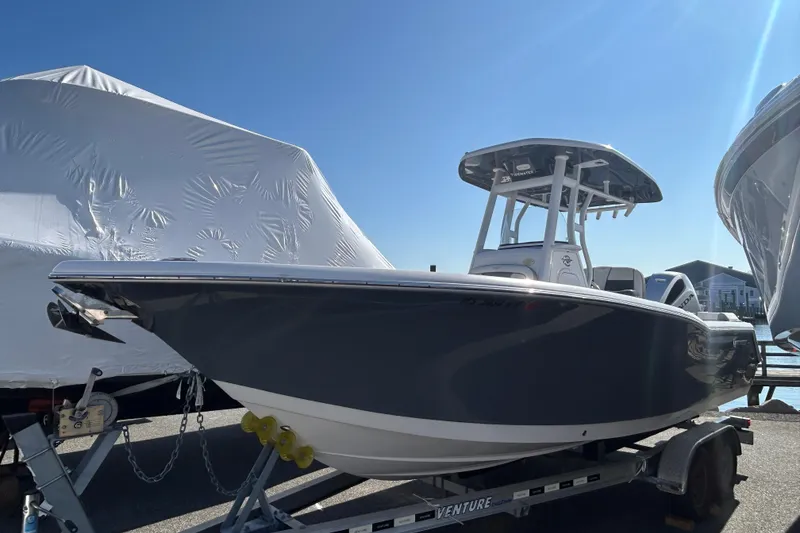 The Image of 2020 Tidewater 232 LXF boat on trailer under clear blue sky. - 0